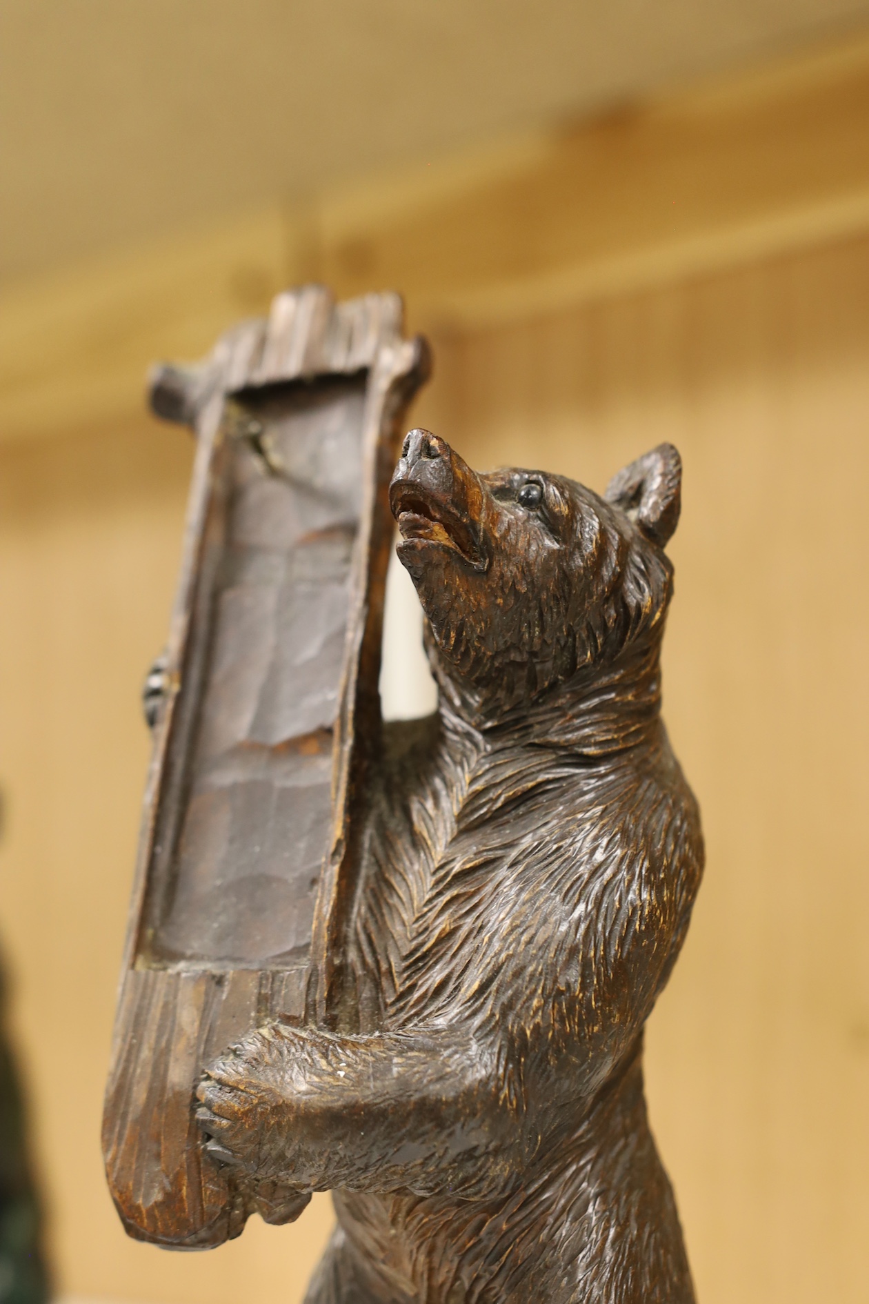 A Black Forest bear stand, 23cm high. Condition - fair needs re waxing